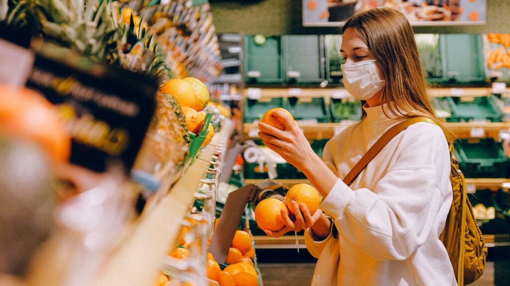 Woman wearing mask whilst grocery shopping